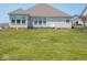 Expansive backyard with well-maintained lawn and patio at 7329 Birch Leaf Dr, Indianapolis, IN 46259