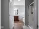 Bathroom with a double vanity, soaking tub, and glass shower at 7329 Birch Leaf Dr, Indianapolis, IN 46259