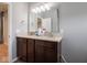 Bathroom showcasing a double vanity with a large mirror and updated fixtures at 7329 Birch Leaf Dr, Indianapolis, IN 46259