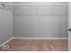 Walk-in closet with carpet and shelving at 7329 Birch Leaf Dr, Indianapolis, IN 46259
