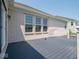 Outdoor deck showcases gray composite flooring and white railings, perfect for relaxing and entertaining at 7329 Birch Leaf Dr, Indianapolis, IN 46259