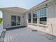 Contemporary deck featuring gray composite flooring, clean white railings, and a sliding glass door entrance at 7329 Birch Leaf Dr, Indianapolis, IN 46259