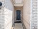 The entryway is brick with a dark front door and a small concrete walkway at 7329 Birch Leaf Dr, Indianapolis, IN 46259