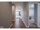 Hallway with hard surface floors leading into carpeted living area with natural light at 7329 Birch Leaf Dr, Indianapolis, IN 46259