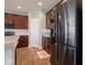 The kitchen features stainless steel appliances, wood cabinets, and a tile backsplash at 7329 Birch Leaf Dr, Indianapolis, IN 46259