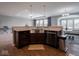 The kitchen sink is centered in the kitchen island with a stainless steel dishwasher at 7329 Birch Leaf Dr, Indianapolis, IN 46259
