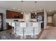 Modern kitchen with sleek cabinetry, stainless steel appliances, and central island with barstool seating at 7329 Birch Leaf Dr, Indianapolis, IN 46259
