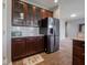 The kitchen has stainless steel appliances, wood cabinets, and quartz countertops at 7329 Birch Leaf Dr, Indianapolis, IN 46259