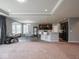 Living room flows into a kitchen with a central island and barstool seating at 7329 Birch Leaf Dr, Indianapolis, IN 46259