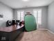Office with a large desk and two windows at 7329 Birch Leaf Dr, Indianapolis, IN 46259