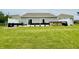 Spacious backyard with a patio, hot tub, black grills, and green space at 7611 Cloudy Ct, Camby, IN 46113