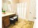 Bathroom with vanity sink, decorative stool and framed shower stall at 7611 Cloudy Ct, Camby, IN 46113