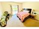 Bright bedroom featuring a cozy bed, a sliding glass door, and neutral carpeting at 7611 Cloudy Ct, Camby, IN 46113