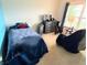 Bedroom with twin bed, dresser, swivel chair and view of the outdoors at 7611 Cloudy Ct, Camby, IN 46113