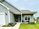 Inviting home exterior featuring manicured landscaping, covered porch, and a secure ADT system at 7611 Cloudy Ct, Camby, IN 46113