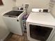 Modern laundry room with a new, white Samsung washer and dryer at 7611 Cloudy Ct, Camby, IN 46113
