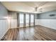 Large bedroom with new flooring, bright windows with curtains, and wainscotting at 7657 Wheatgrass Ln, Noblesville, IN 46062