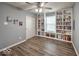 Charming bedroom with built-in bookcases and hardwood flooring, offering ample storage at 7657 Wheatgrass Ln, Noblesville, IN 46062