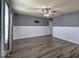 Stylish bedroom with new flooring, wainscotting, and modern ceiling fan at 7657 Wheatgrass Ln, Noblesville, IN 46062