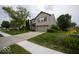 Suburban home featuring a two-car garage, brick facade, and green lawn at 7657 Wheatgrass Ln, Noblesville, IN 46062