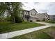 Charming two-story home with brick accents, attached garage, and well-manicured lawn at 7657 Wheatgrass Ln, Noblesville, IN 46062