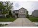 Traditional two-story home with brick front, attached two-car garage, and landscaped front yard at 7657 Wheatgrass Ln, Noblesville, IN 46062