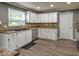 Bright kitchen featuring ample counter space, sleek stainless steel appliances, and modern cabinetry at 7657 Wheatgrass Ln, Noblesville, IN 46062