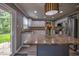 Well-lit kitchen with granite countertops, stainless steel appliances, and island seating at 7657 Wheatgrass Ln, Noblesville, IN 46062