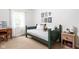 bedroom with day bed, neutral walls, carpet floors, and a window for natural light at 8436 N Meridian St, Indianapolis, IN 46260