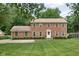 Charming brick two-story home featuring manicured lawn and inviting entrance at 8436 N Meridian St, Indianapolis, IN 46260