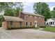 Charming brick two-story home featuring manicured lawn and inviting entrance at 8436 N Meridian St, Indianapolis, IN 46260