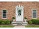 Inviting front entrance with decorative wreath and well-maintained landscaping at 8436 N Meridian St, Indianapolis, IN 46260