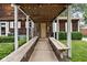 Charming covered front porch with string lights, offering a warm and inviting entrance to the home at 8436 N Meridian St, Indianapolis, IN 46260