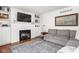 This comfortable living room features a fireplace with built-ins and a grey sofa for a relaxed atmosphere at 8436 N Meridian St, Indianapolis, IN 46260