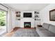 Cozy living room offers built-in shelving, a fireplace, and a sliding door that provides lots of light at 8436 N Meridian St, Indianapolis, IN 46260