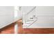 Bright staircase with hardwood floors, white trim, and an open landing at 8436 N Meridian St, Indianapolis, IN 46260