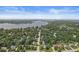 Stunning aerial view of lakefront homes surrounded by lush trees in a tranquil neighborhood at 8712 Admirals Bay Dr, Indianapolis, IN 46236