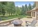 A backyard deck, chairs, and a firepit offer a great place for outdoor entertaining at 8712 Admirals Bay Dr, Indianapolis, IN 46236