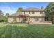 The back of a well-maintained home showing a deck and a green lawn at 8712 Admirals Bay Dr, Indianapolis, IN 46236