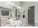 Bright bathroom with a double vanity, skylight, and direct access to a private toilet at 8712 Admirals Bay Dr, Indianapolis, IN 46236