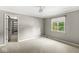Neutral bedroom with a walk-in closet and a window view of lush greenery at 8712 Admirals Bay Dr, Indianapolis, IN 46236