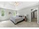 Light-filled bedroom with a trey ceiling and windows offering a scenic outdoor view at 8712 Admirals Bay Dr, Indianapolis, IN 46236