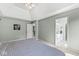 Spacious bedroom with neutral-toned walls, and access to a well-lit ensuite bathroom at 8712 Admirals Bay Dr, Indianapolis, IN 46236