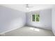 Bedroom with soft blue walls, carpet flooring, with a ceiling fan and a window with view at 8712 Admirals Bay Dr, Indianapolis, IN 46236