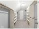 Spacious walk-in closet with carpeted floors, shelving, and closet rod perfect for storage at 8712 Admirals Bay Dr, Indianapolis, IN 46236