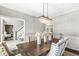 Beautiful dining room featuring chandelier lighting, an adjacent staircase, and ample space for entertainment at 8712 Admirals Bay Dr, Indianapolis, IN 46236