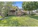 Charming two-story brick home with manicured lawn and lush landscaping at 8712 Admirals Bay Dr, Indianapolis, IN 46236