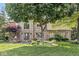 Traditional brick home featuring well-maintained landscaping and a welcoming entrance at 8712 Admirals Bay Dr, Indianapolis, IN 46236