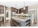 Spacious kitchen boasting custom cabinetry, granite countertops, an island with bar seating, and stainless steel appliances at 8712 Admirals Bay Dr, Indianapolis, IN 46236