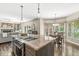 Open kitchen with island stove, breakfast nook and living room offering an ideal flow for entertaining at 8712 Admirals Bay Dr, Indianapolis, IN 46236
